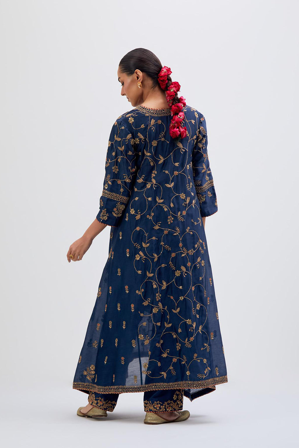 Prussian Blue Silk Chanderi kurta set with asymmetric hem and all-over dull gold dori embroidery, highlighted with multi colored beads and gold sequins.