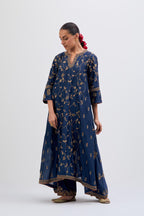 Prussian Blue Silk Chanderi kurta set with asymmetric hem and all-over dull gold dori embroidery, highlighted with multi colored beads and gold sequins.