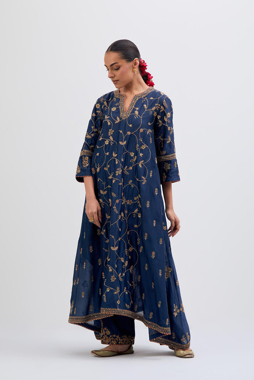 Prussian Blue Silk Chanderi kurta set with asymmetric hem and all-over dull gold dori embroidery, highlighted with multi colored beads and gold sequins.