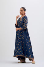 Prussian Blue Silk Chanderi kurta set with asymmetric hem and all-over dull gold dori embroidery, highlighted with multi colored beads and gold sequins.