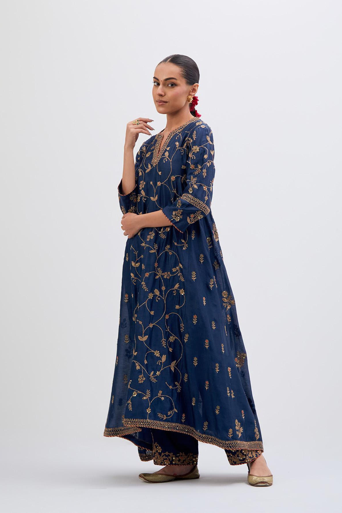 Prussian Blue Silk Chanderi kurta set with asymmetric hem and all-over dull gold dori embroidery, highlighted with multi colored beads and gold sequins.