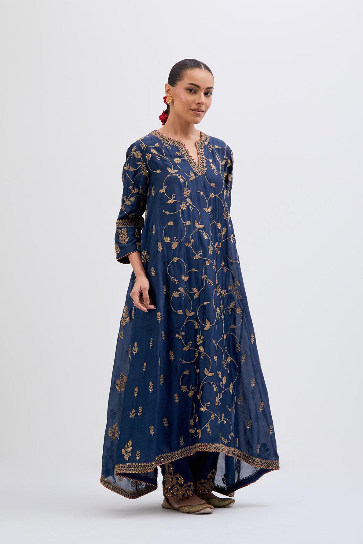 Prussian Blue Silk Chanderi kurta set with asymmetric hem and all-over dull gold dori embroidery, highlighted with multi colored beads and gold sequins.