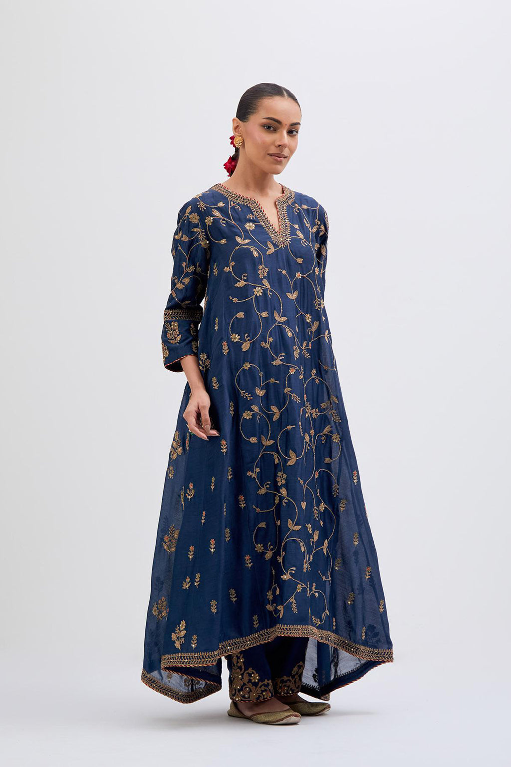 Prussian Blue Silk Chanderi kurta set with asymmetric hem and all-over dull gold dori embroidery, highlighted with multi colored beads and gold sequins.