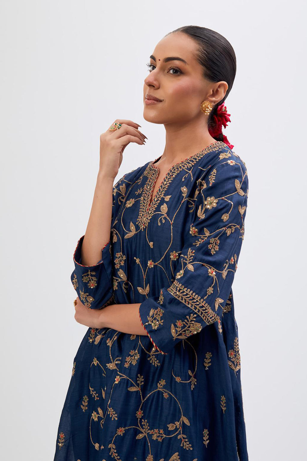 Prussian Blue Silk Chanderi kurta set with asymmetric hem and all-over dull gold dori embroidery, highlighted with multi colored beads and gold sequins.