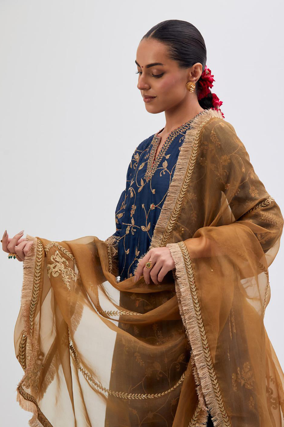 Prussian Blue Silk Chanderi kurta set with asymmetric hem and all-over dull gold dori embroidery, highlighted with multi colored beads and gold sequins.