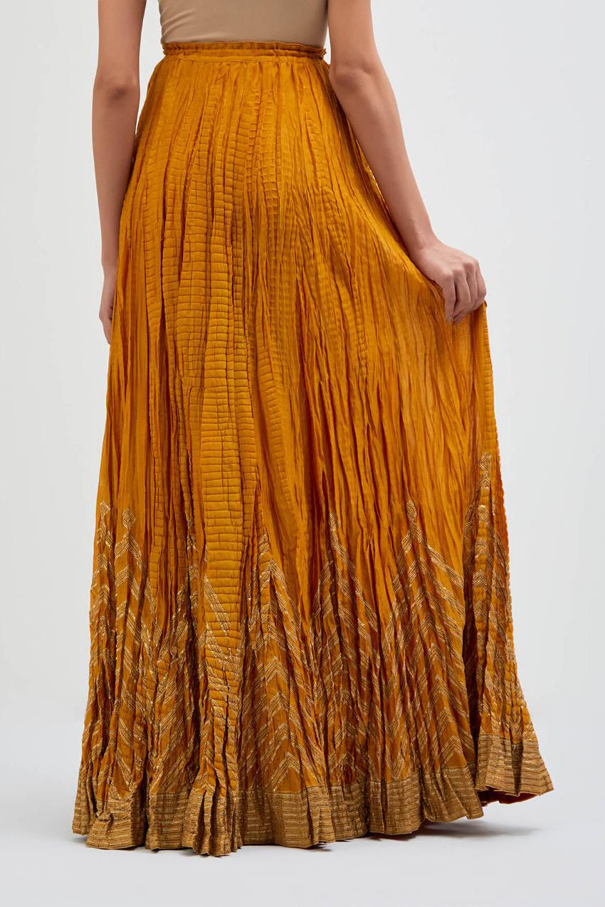 Chanderi 40 kali lehenga edged with dull gold gota embroidery and contrast chanderi facings.
