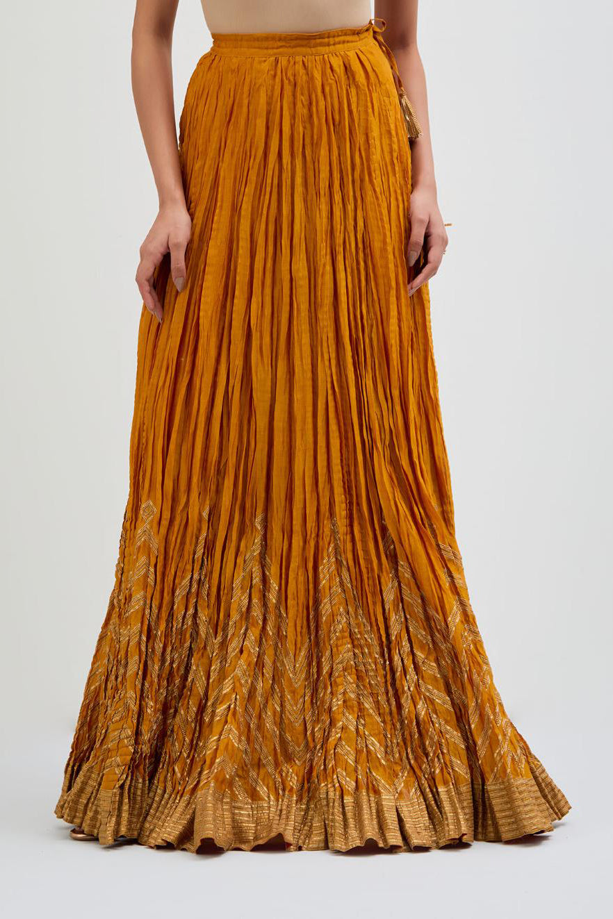 Chanderi 40 kali lehenga edged with dull gold gota embroidery and contrast chanderi facings.