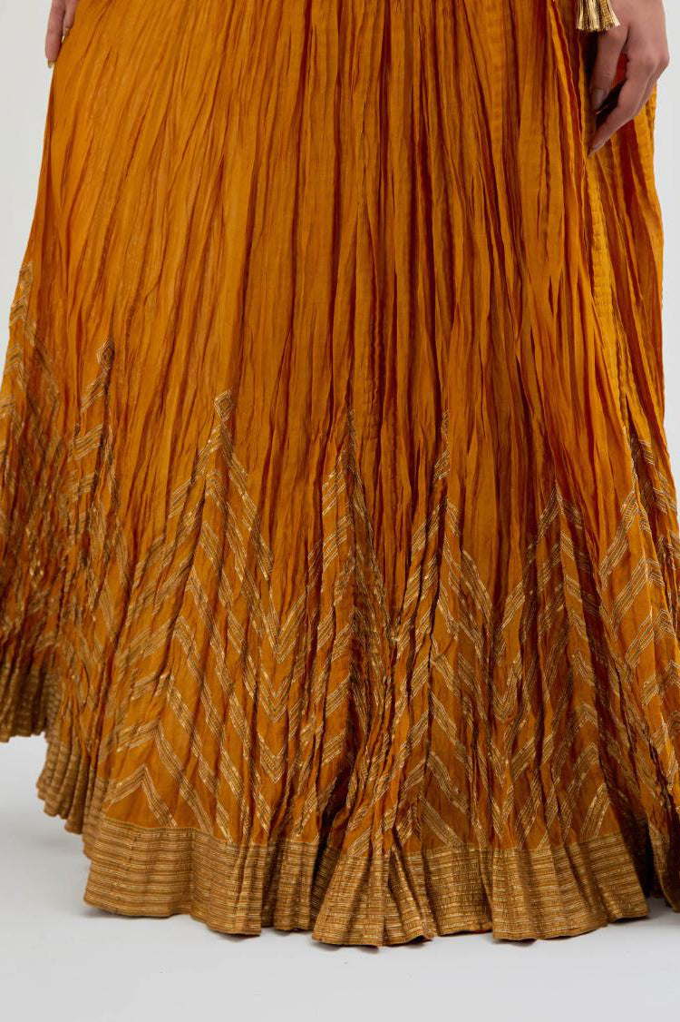 Chanderi 40 kali lehenga edged with dull gold gota embroidery and contrast chanderi facings.