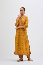 Deep Yellow Silk Chanderi kurta set with all-over dull gold dori jaal embroidery and small floral booti at side panels.