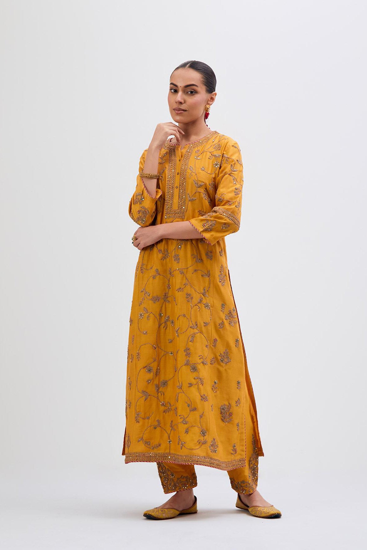 Deep Yellow Silk Chanderi kurta set with all-over dull gold dori jaal embroidery and small floral booti at side panels.