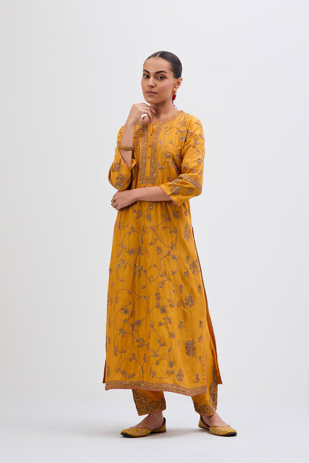 Deep Yellow Silk Chanderi kurta set with all-over dull gold dori jaal embroidery and small floral booti at side panels.