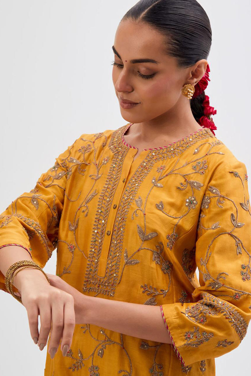 Deep Yellow Silk Chanderi kurta set with all-over dull gold dori jaal embroidery and small floral booti at side panels.