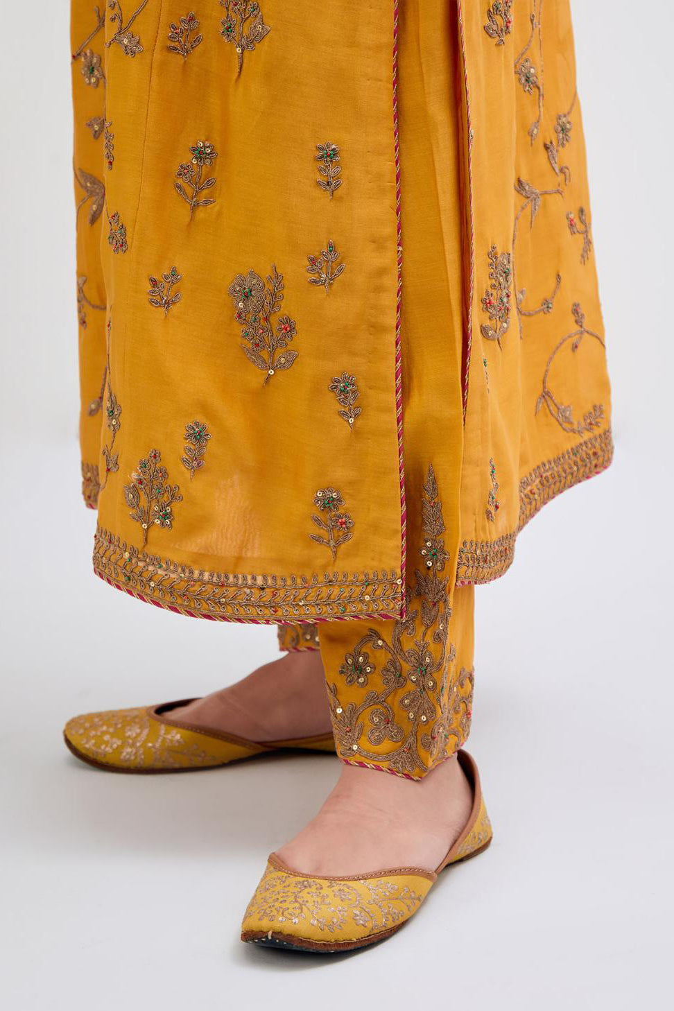 Deep Yellow Silk Chanderi kurta set with all-over dull gold dori jaal embroidery and small floral booti at side panels.