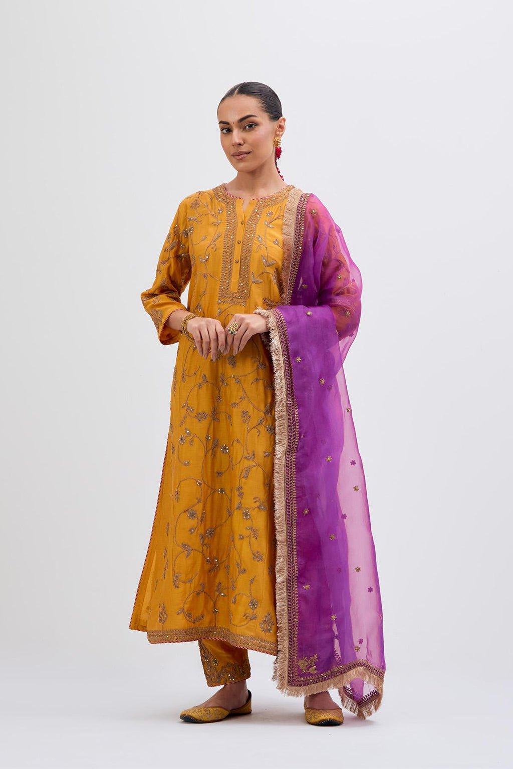Deep Yellow Silk Chanderi kurta set with all-over dull gold dori jaal embroidery and small floral booti at side panels.