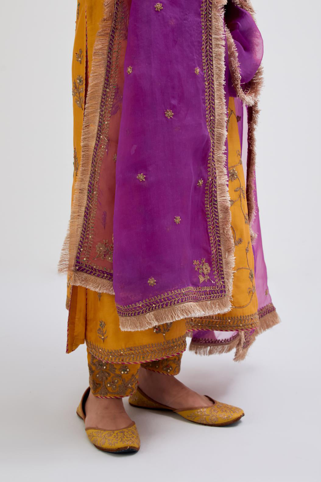 Purple Silk Organza dupatta detailed with all-over dull gold dori small floral booti embroidery, highlighted with multi colored beads and gold sequins work.