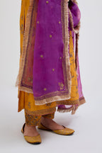 Deep Yellow Silk Chanderi kurta set with all-over dull gold dori jaal embroidery and small floral booti at side panels.