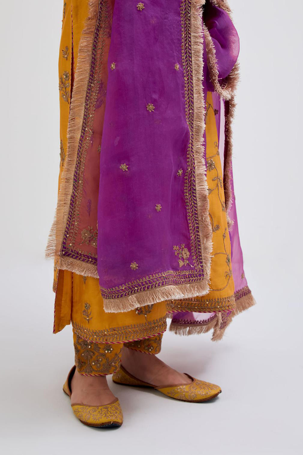 Deep Yellow Silk Chanderi kurta set with all-over dull gold dori jaal embroidery and small floral booti at side panels.