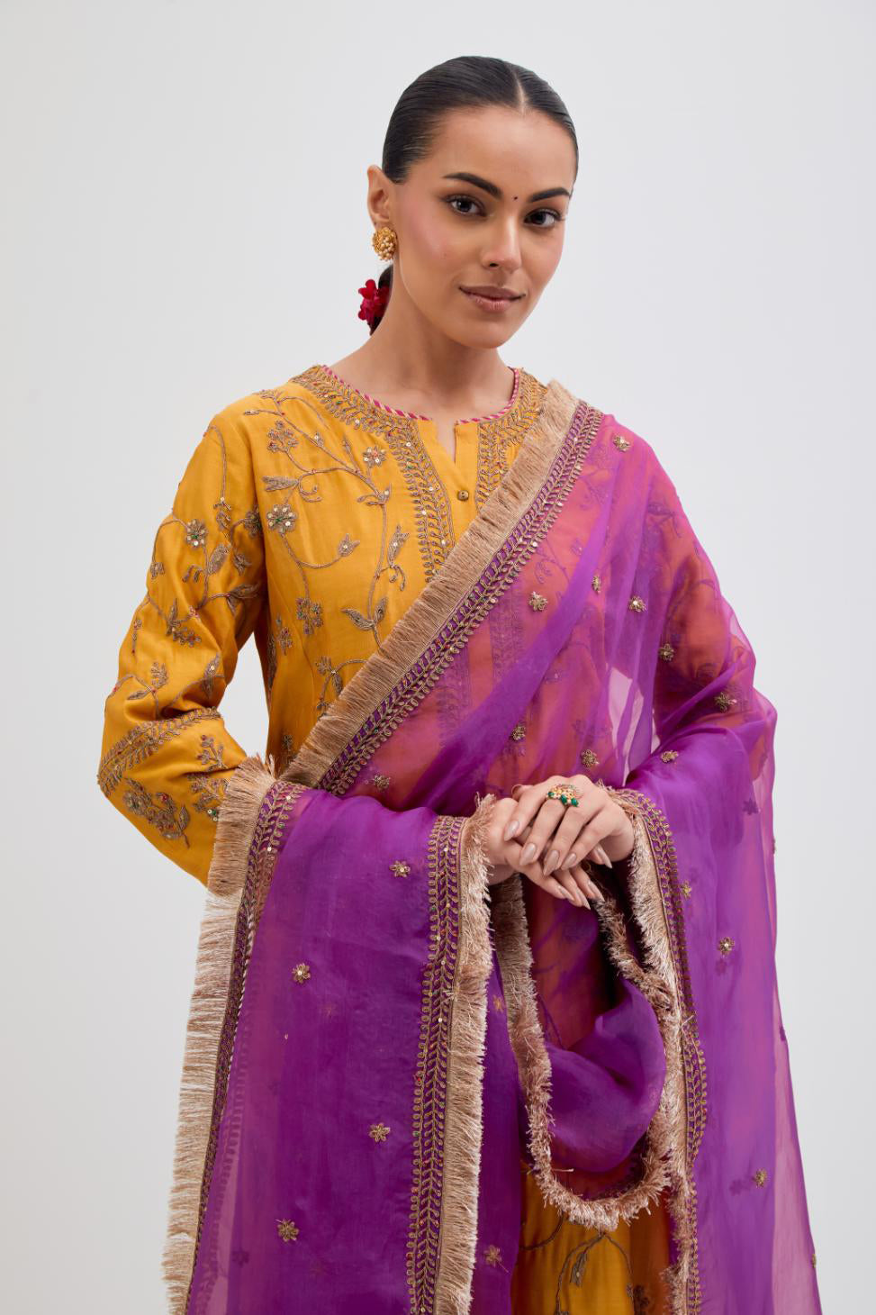 Purple Silk Organza dupatta detailed with all-over dull gold dori small floral booti embroidery, highlighted with multi colored beads and gold sequins work.