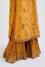 Deep Yellow Silk Chanderi kurta set  with all-over dull gold dori jaal embroidery and small floral booti at side panels.