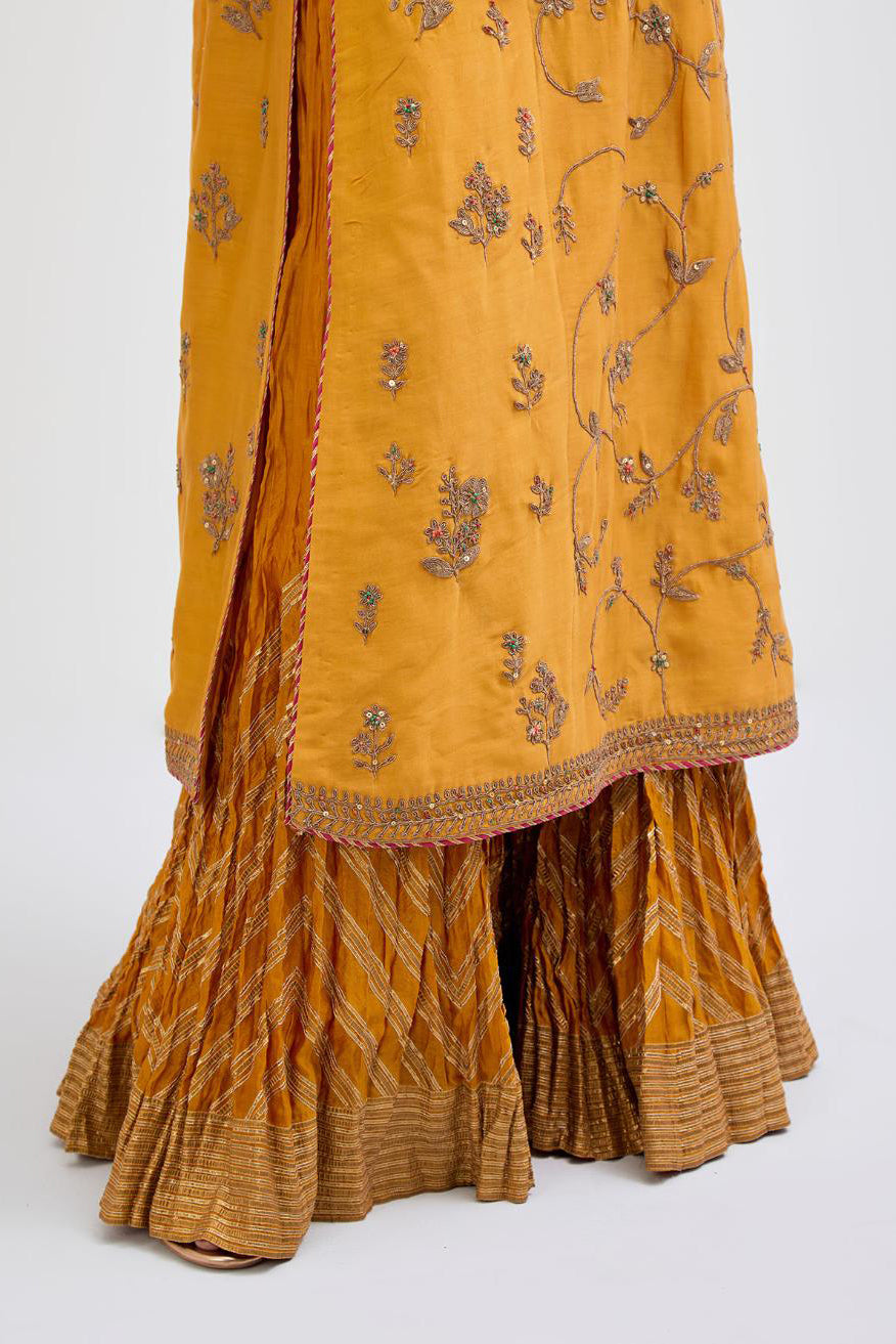 Deep Yellow Silk Chanderi kurta set  with all-over dull gold dori jaal embroidery and small floral booti at side panels.