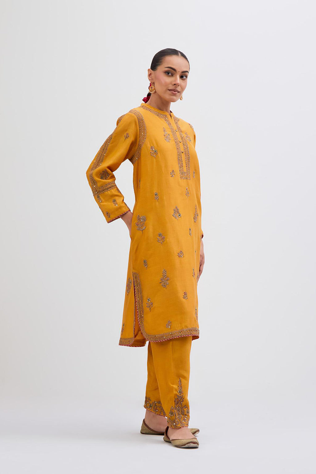 Deep Yellow Silk Chanderi short kurta set with dull gold dori embroidery, highlighted with gold sequins and bead work.