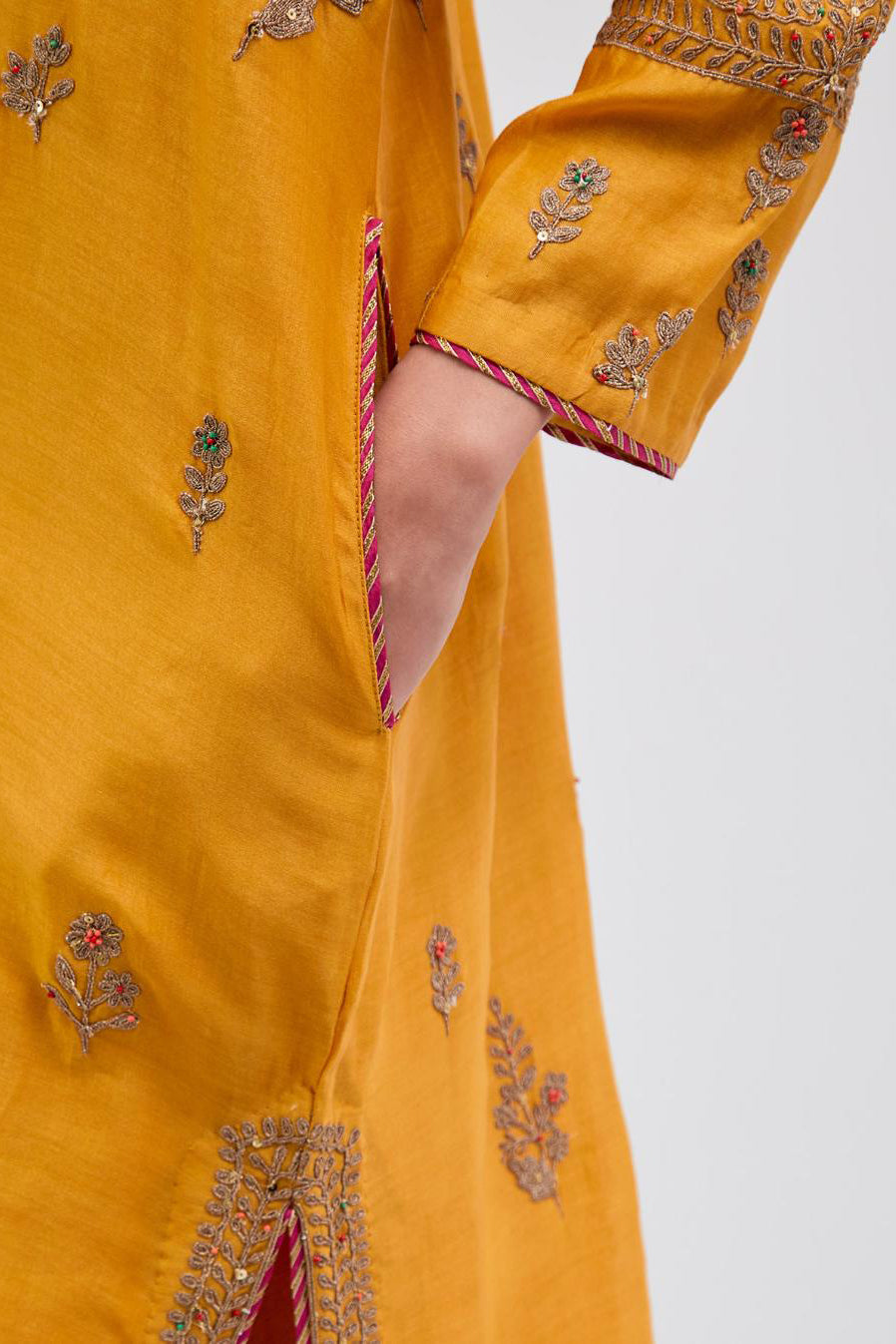 Deep Yellow Silk Chanderi short kurta set with dull gold dori embroidery, highlighted with gold sequins and bead work.