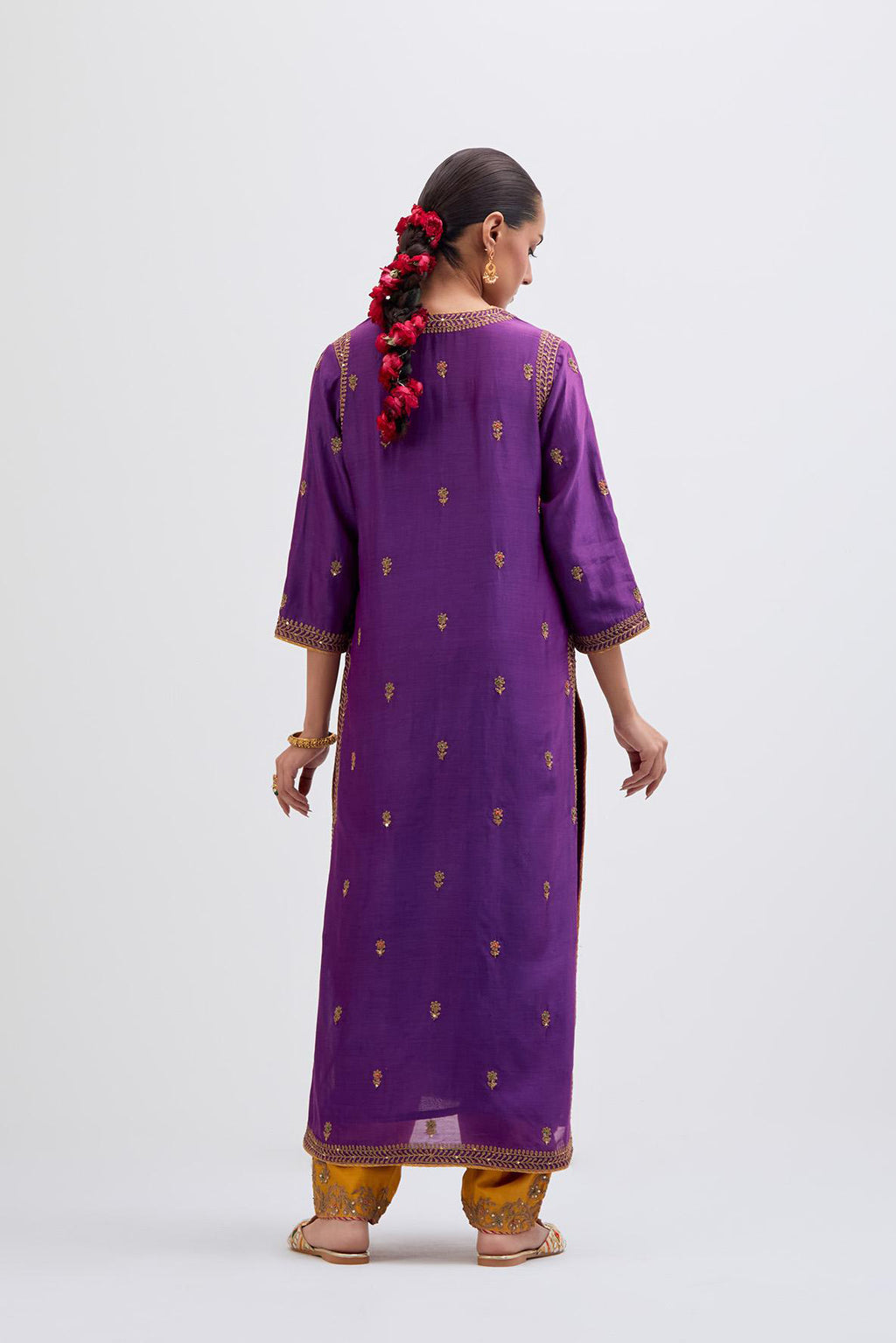 Fuchsia Silk Chanderi straight kurta set with narrow border dull gold dori embroidery at front & back neck, sleeves, side slits and hem, highlighted with gold sequins and bead work.