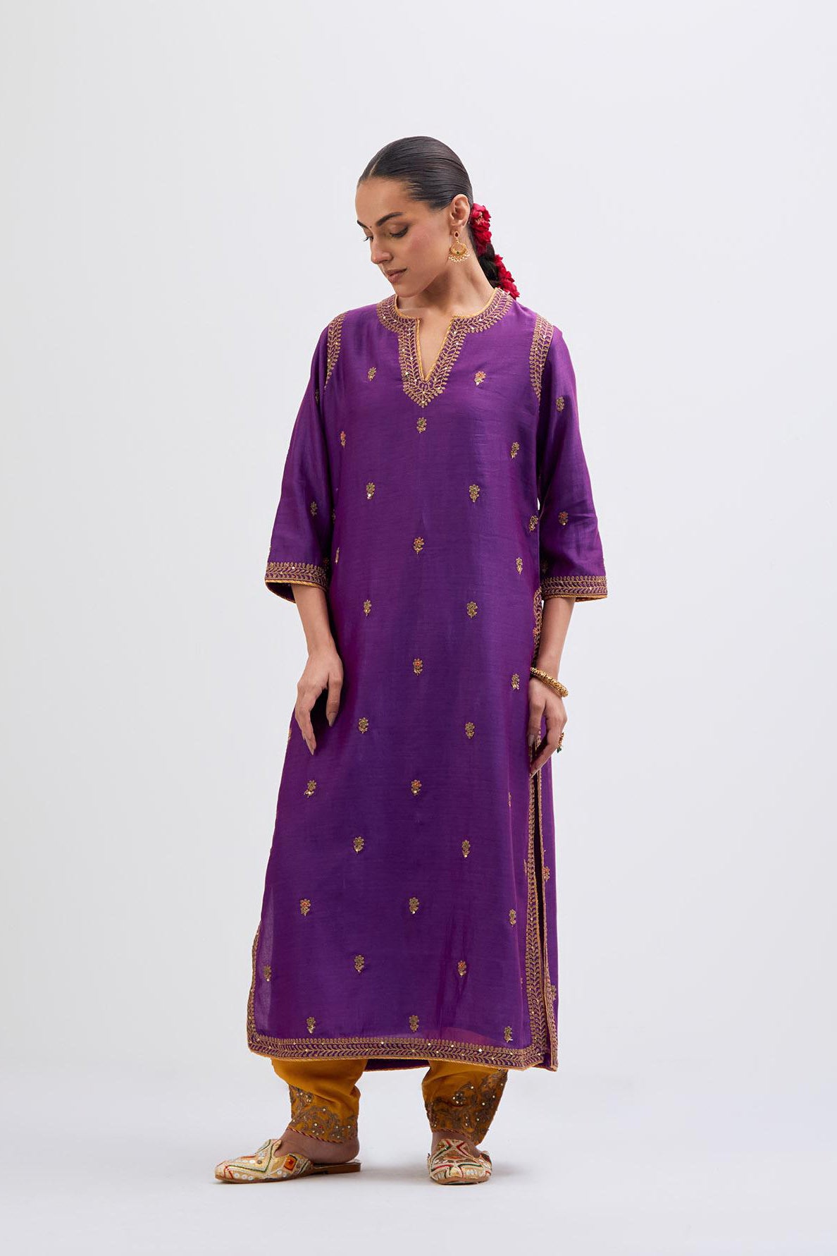 Purple Silk Chanderi straight kurta set with narrow border dull gold dori embroidery at front & back neck, sleeves, side slits and hem, highlighted with gold sequins and bead work.