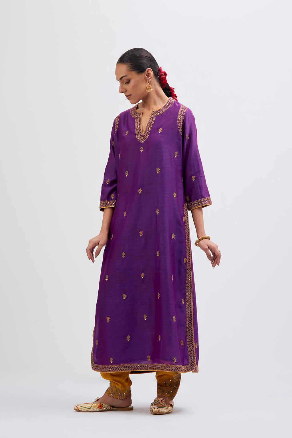 Purple Silk Chanderi straight kurta set with narrow border dull gold dori embroidery at front & back neck, sleeves, side slits and hem, highlighted with gold sequins and bead work.