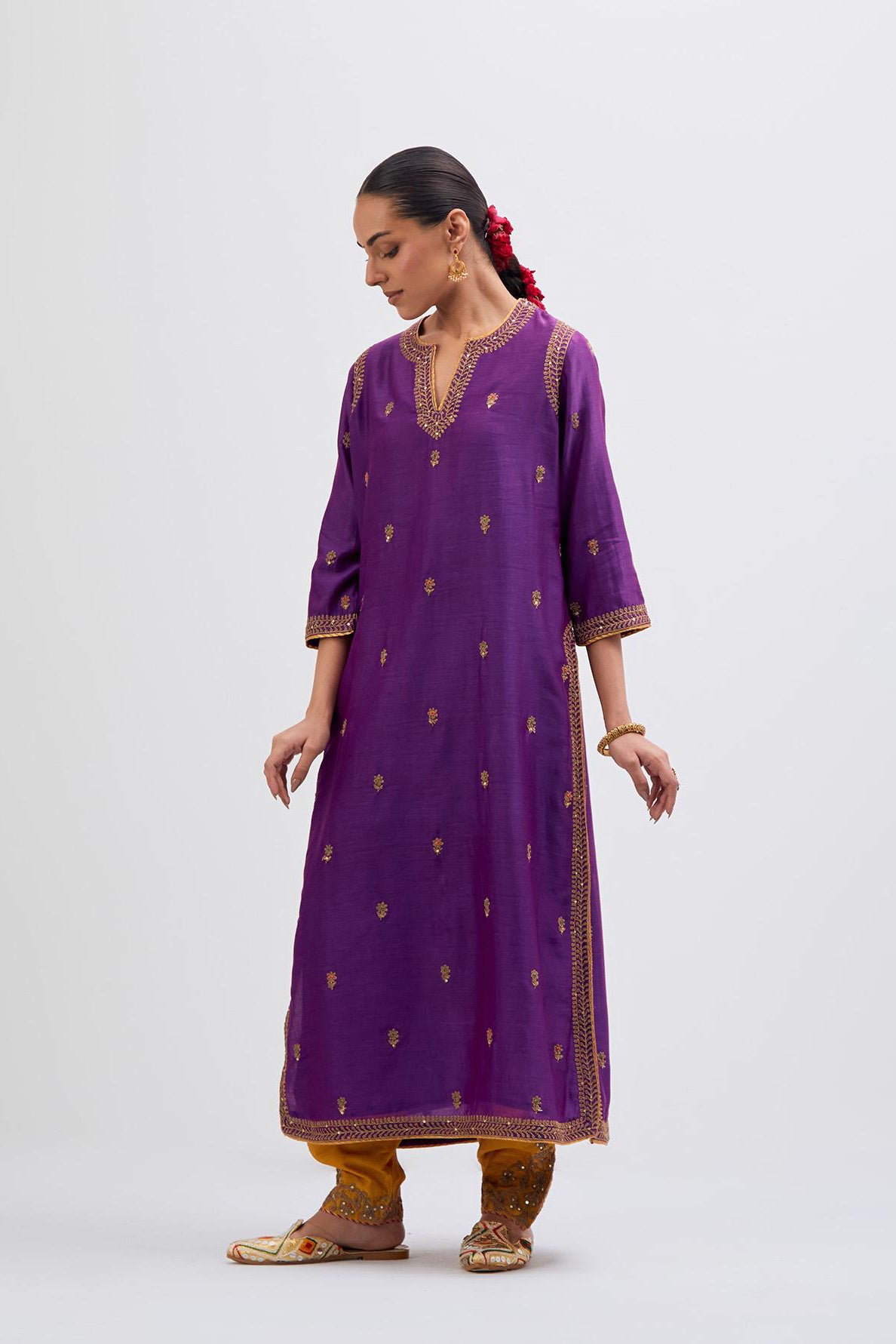 Purple Silk Chanderi straight kurta set with narrow border dull gold dori embroidery at front & back neck, sleeves, side slits and hem, highlighted with gold sequins and bead work.