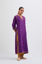 Purple Silk Chanderi straight kurta set with narrow border dull gold dori embroidery at front & back neck, sleeves, side slits and hem, highlighted with gold sequins and bead work.