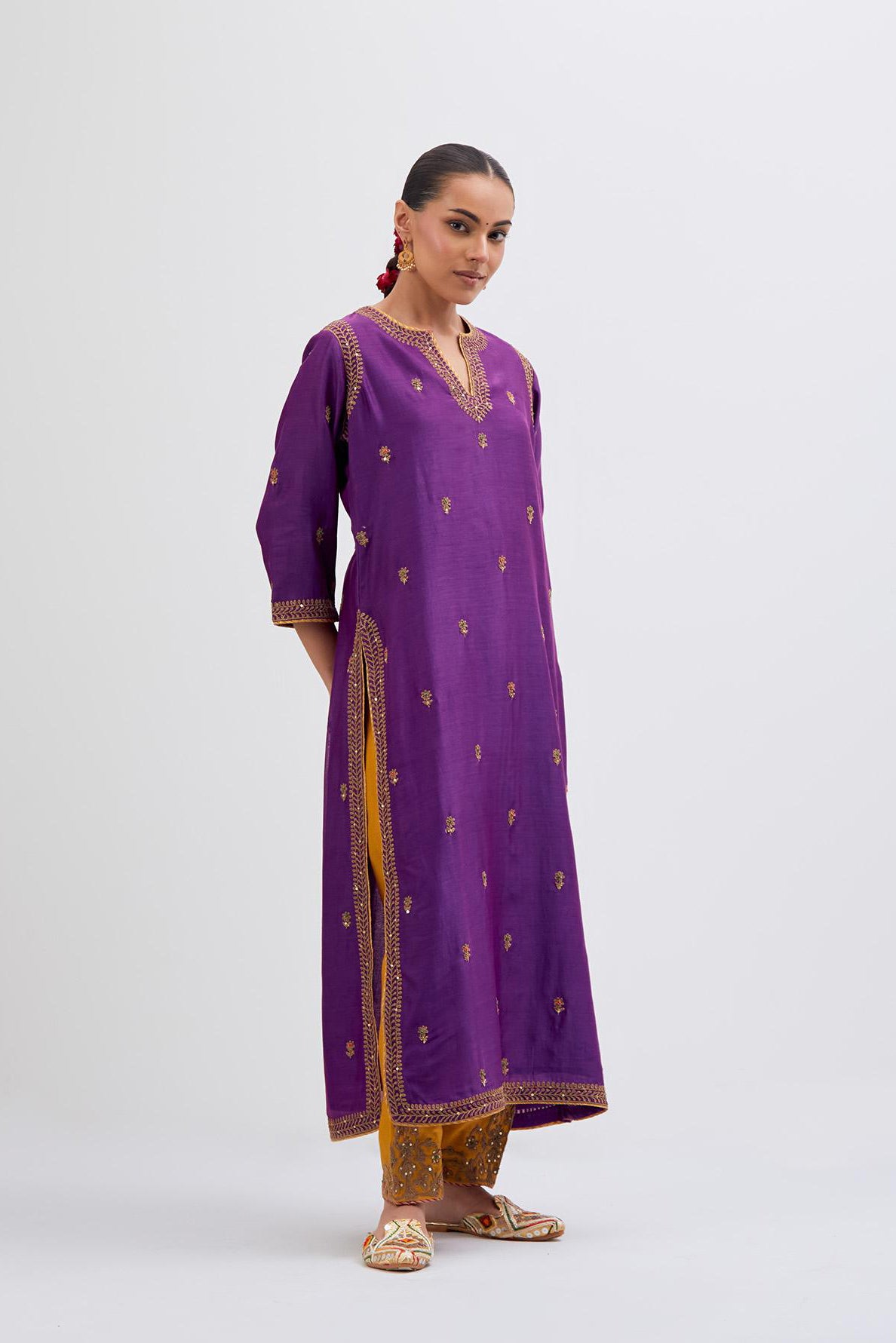 Purple Silk Chanderi straight kurta set with narrow border dull gold dori embroidery at front & back neck, sleeves, side slits and hem, highlighted with gold sequins and bead work.