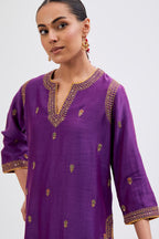 Purple Silk Chanderi straight kurta set with narrow border dull gold dori embroidery at front & back neck, sleeves, side slits and hem, highlighted with gold sequins and bead work.