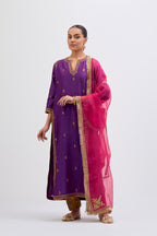 Purple Silk Chanderi straight kurta set with narrow border dull gold dori embroidery at front & back neck, sleeves, side slits and hem, highlighted with gold sequins and bead work.