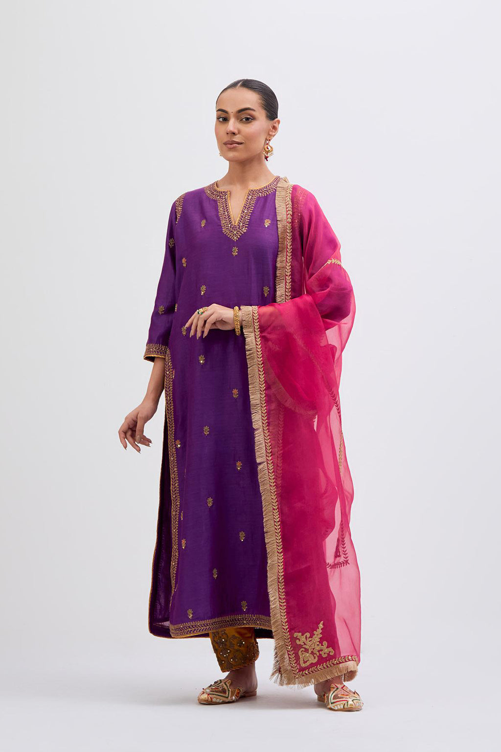 Fuchsia Silk Chanderi straight kurta set with narrow border dull gold dori embroidery at front & back neck, sleeves, side slits and hem, highlighted with gold sequins and bead work.