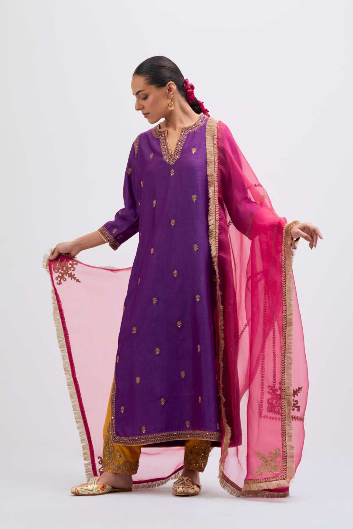 Fuchsia Silk Organza dupatta detailed with all-over dull gold dori embroidery, highlighted with multi colored beads and gold sequins work.