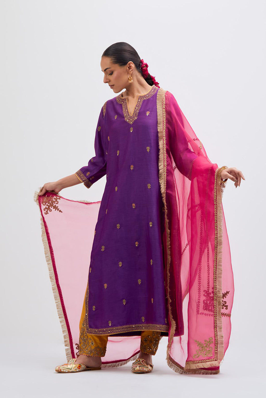 Fuchsia Silk Chanderi straight kurta set with narrow border dull gold dori embroidery at front & back neck, sleeves, side slits and hem, highlighted with gold sequins and bead work.