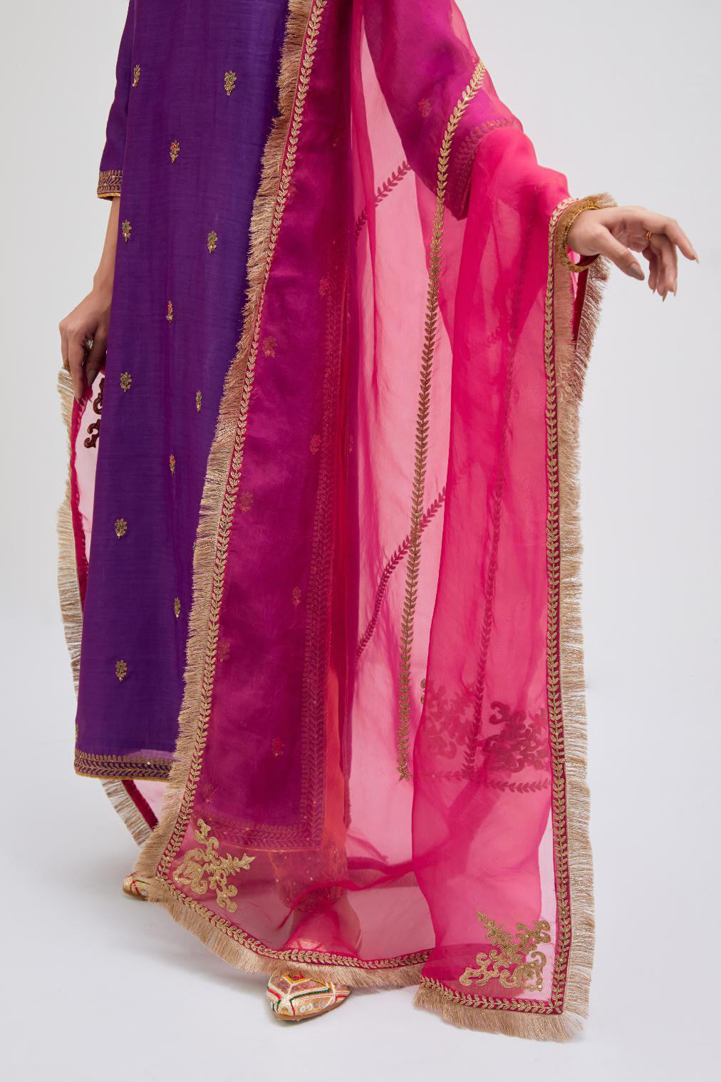 Fuchsia Silk Organza dupatta detailed with all-over dull gold dori embroidery, highlighted with multi colored beads and gold sequins work.