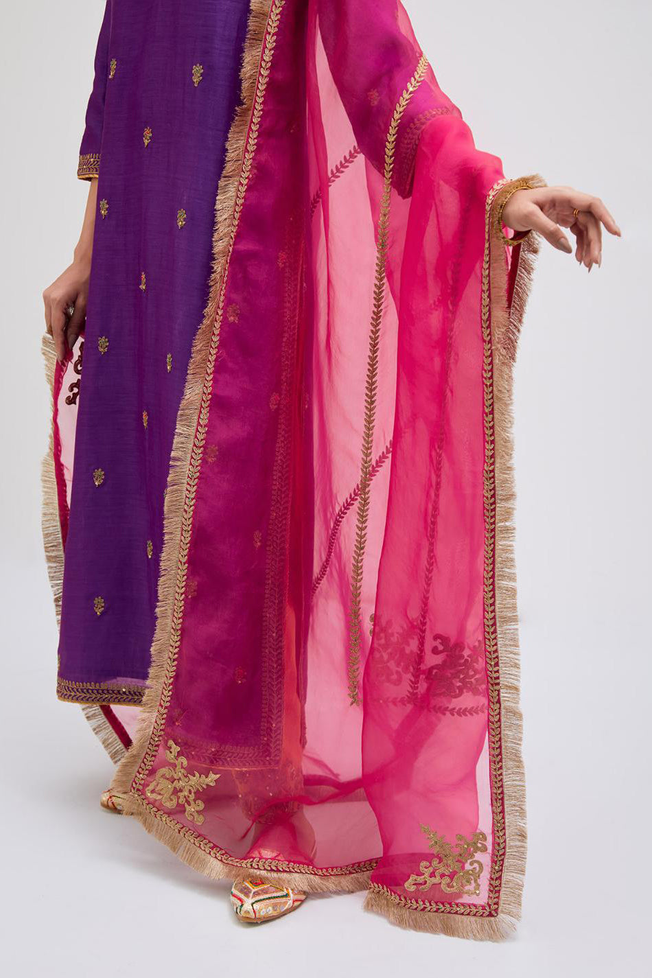 Fuchsia Silk Chanderi straight kurta set with narrow border dull gold dori embroidery at front & back neck, sleeves, side slits and hem, highlighted with gold sequins and bead work.