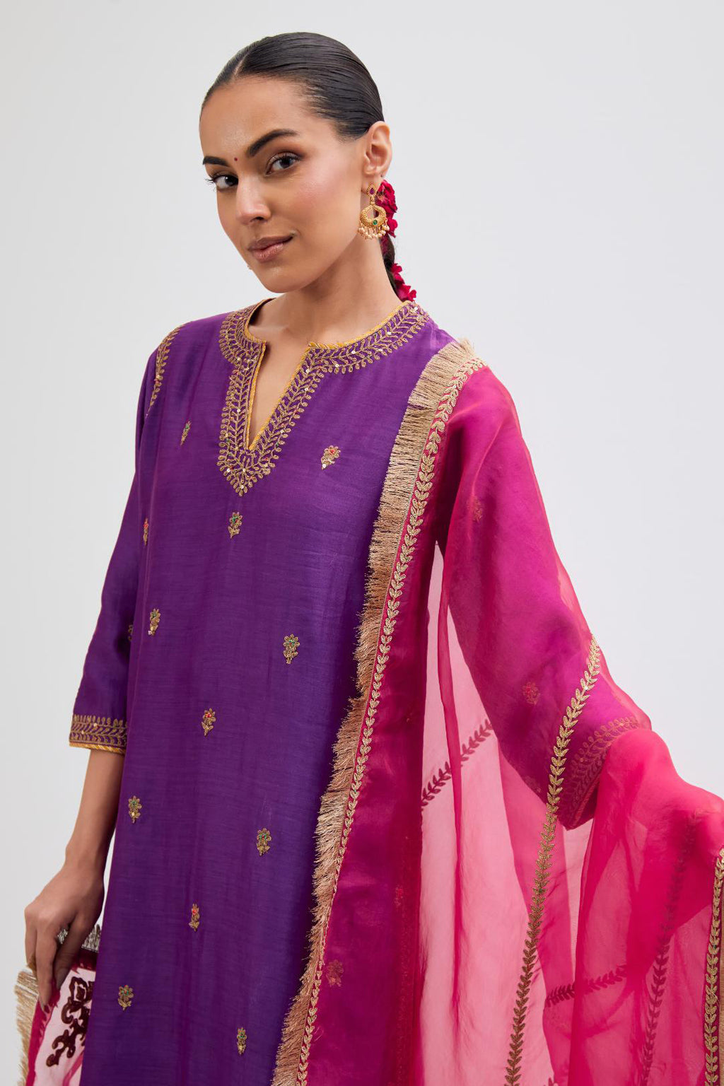 Fuchsia Silk Organza dupatta detailed with all-over dull gold dori embroidery, highlighted with multi colored beads and gold sequins work.