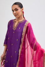 Purple Silk Chanderi straight kurta set with narrow border dull gold dori embroidery at front & back neck, sleeves, side slits and hem, highlighted with gold sequins and bead work.