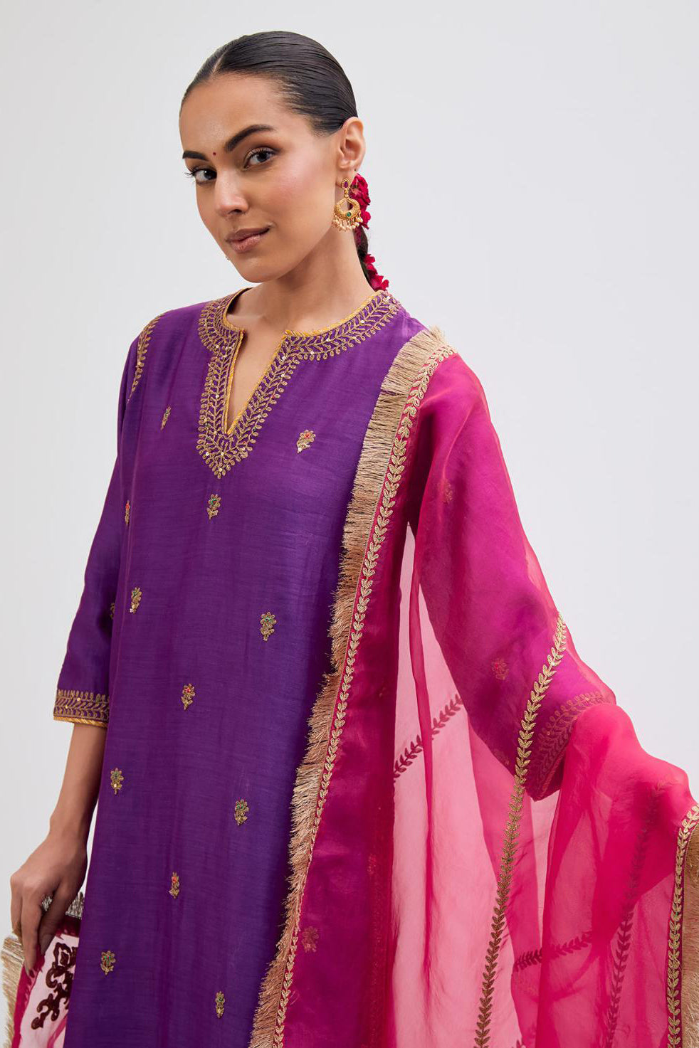 Fuchsia Silk Chanderi straight kurta set with narrow border dull gold dori embroidery at front & back neck, sleeves, side slits and hem, highlighted with gold sequins and bead work.