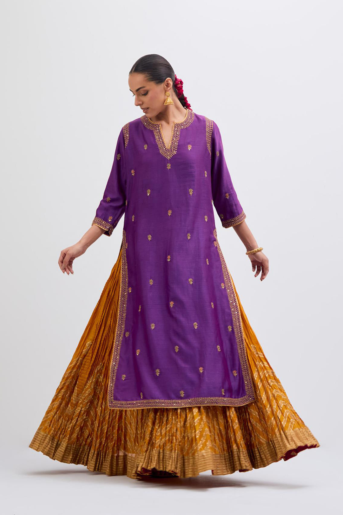 Purple Silk Chanderi straight kurta set with narrow border dull gold dori embroidery at front & back neck, sleeves, side slits and hem, highlighted with gold sequins and bead work.