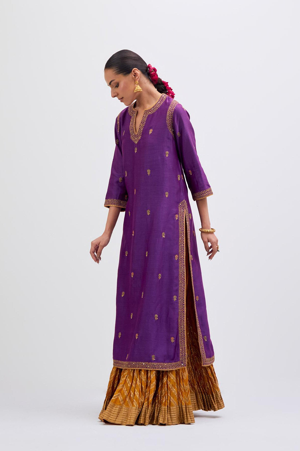 Purple Silk Chanderi straight kurta set with narrow border dull gold dori embroidery at front & back neck, sleeves, side slits and hem, highlighted with gold sequins and bead work.