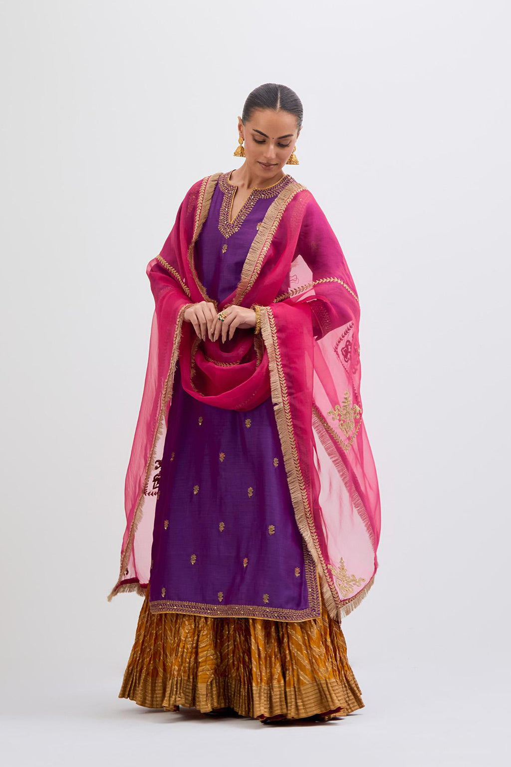 Fuchsia Silk Chanderi straight kurta set with narrow border dull gold dori embroidery at front & back neck, sleeves, side slits and hem, highlighted with gold sequins and bead work.