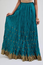 Chanderi 40 kali lehenga edged with dull gold gota embroidery and contrast chanderi facings.