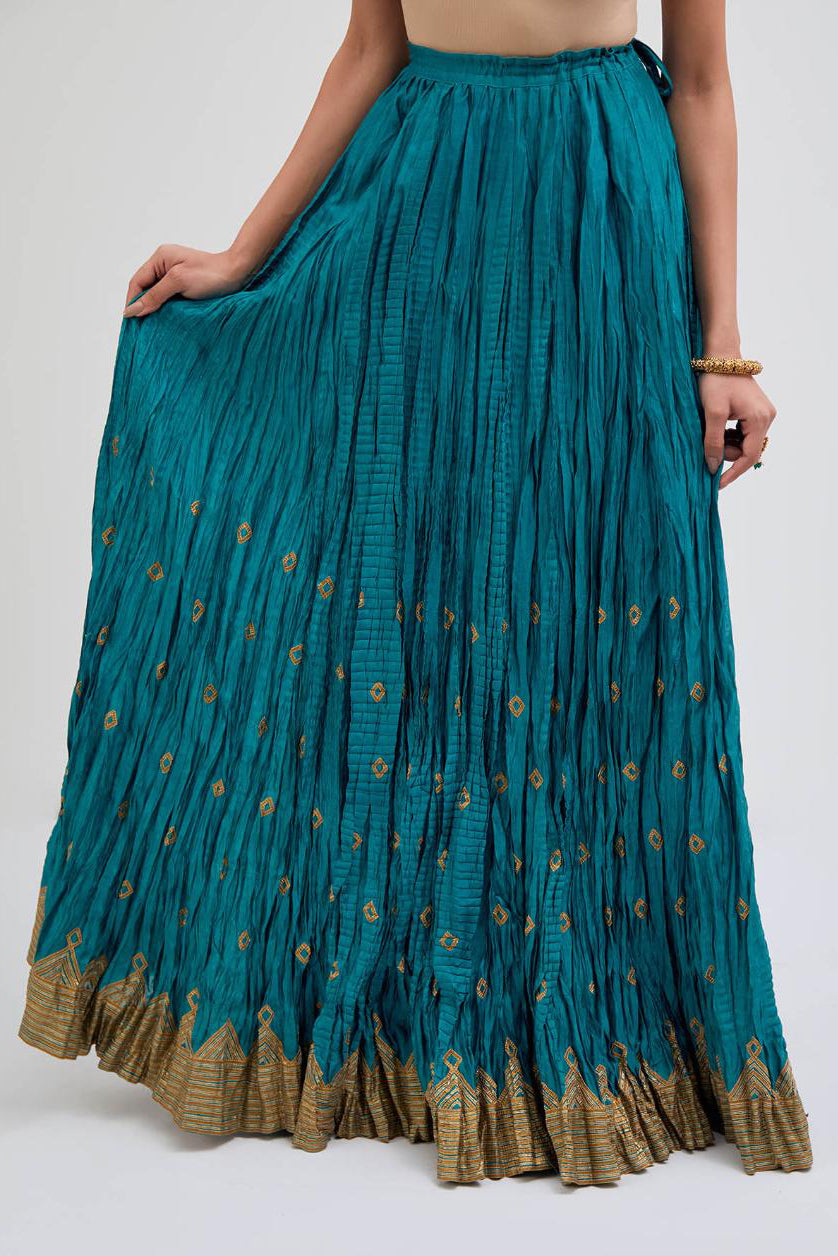 Chanderi 40 kali lehenga edged with dull gold gota embroidery and contrast chanderi facings.