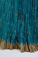 Chanderi 40 kali lehenga edged with dull gold gota embroidery and contrast chanderi facings.