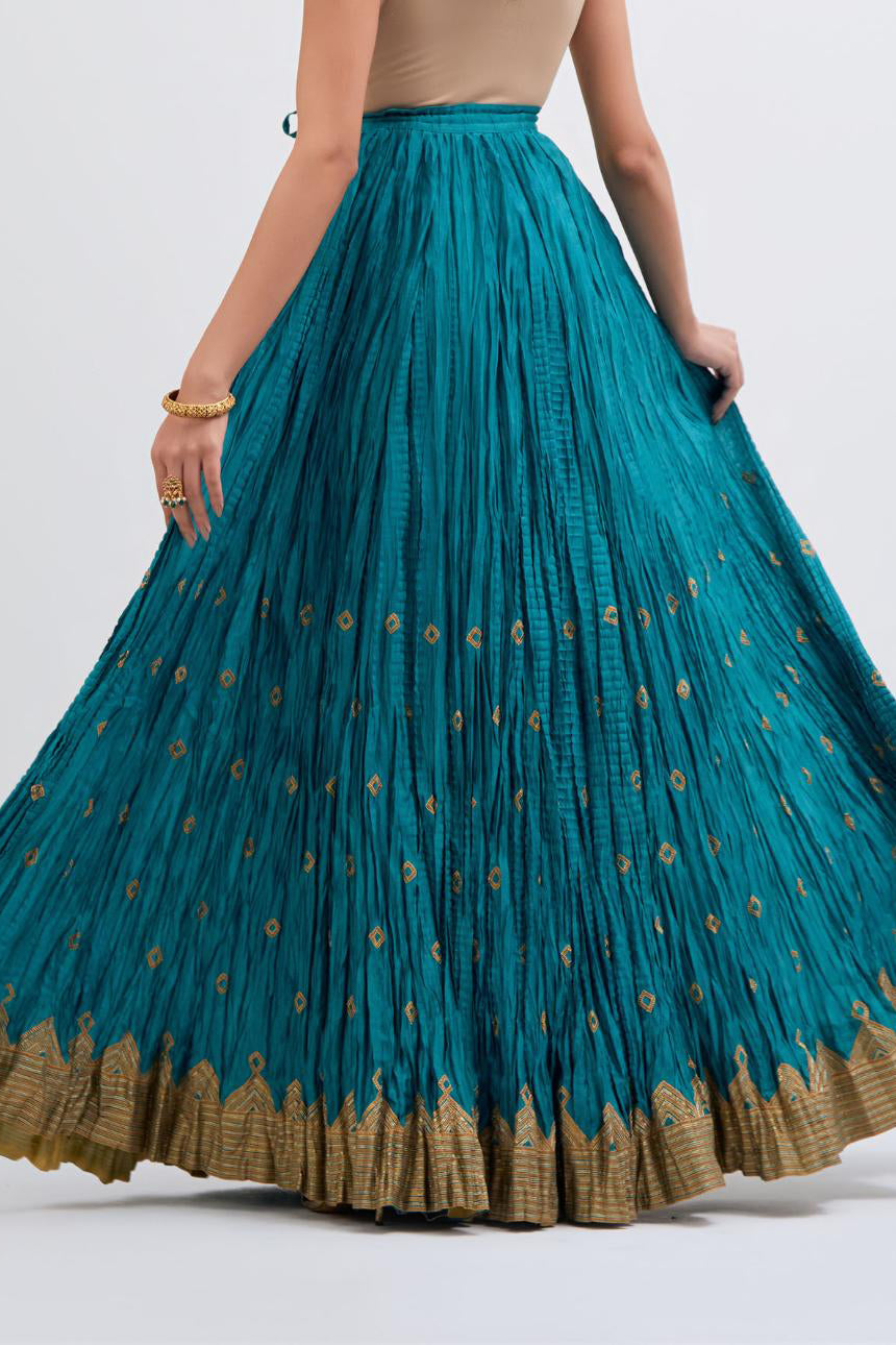 Chanderi 40 kali lehenga edged with dull gold gota embroidery and contrast chanderi facings.