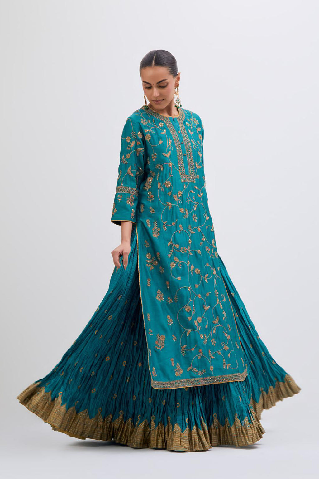 Teal Silk Chanderi kurta set with all-over dull gold dori jaal embroidery and small floral booti at side panels.